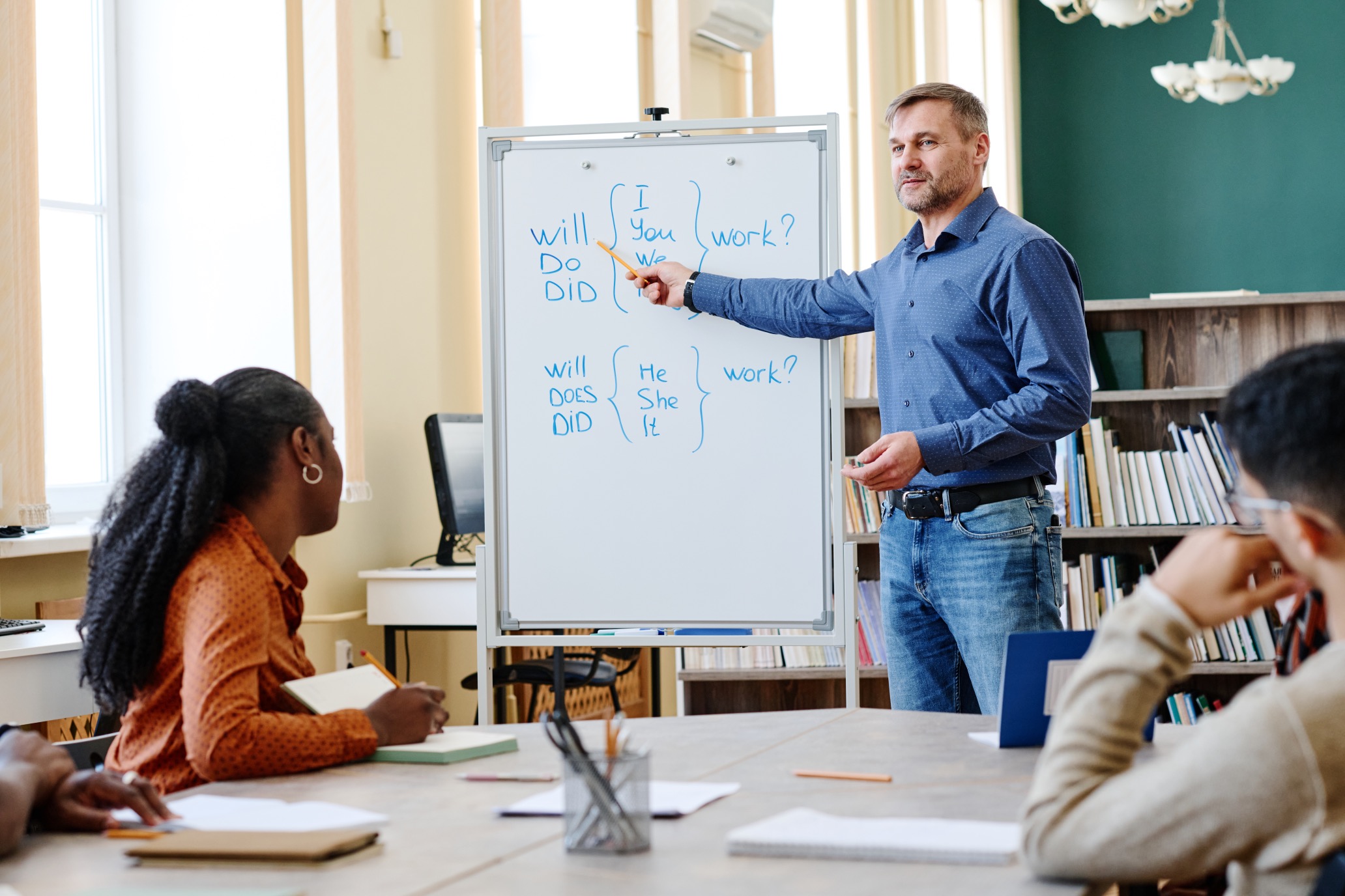 man-teaching-migrants-english-2023-11-27-05-10-58-utc